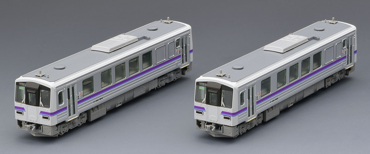 芸備線98161の2両全体。紫系の帯と窓埋めされた側面。写真：TOMIX／トミーテック公式商品資料。