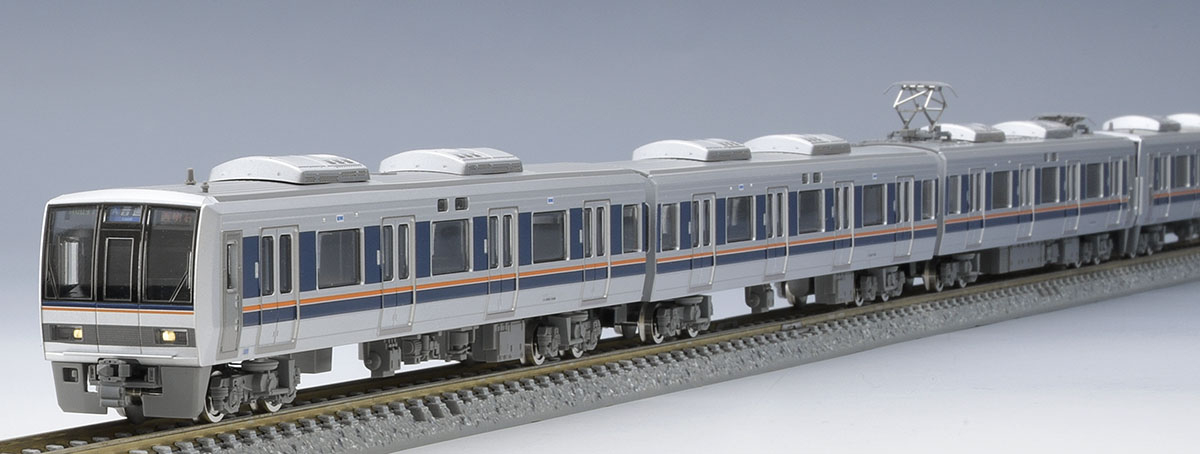 銀色の車体と濃色・オレンジ帯、先頭部から見た編成。レール別売。模型写真：TOMIX公式商品資料。